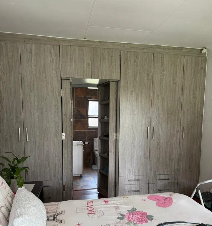 Built-in bedroom cupboards with a passage door
