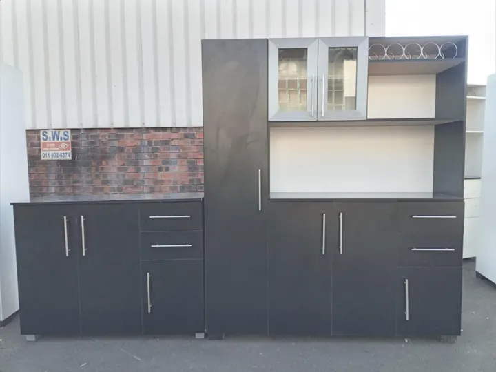 Dark grey kitchen unit with glass-front cabinets