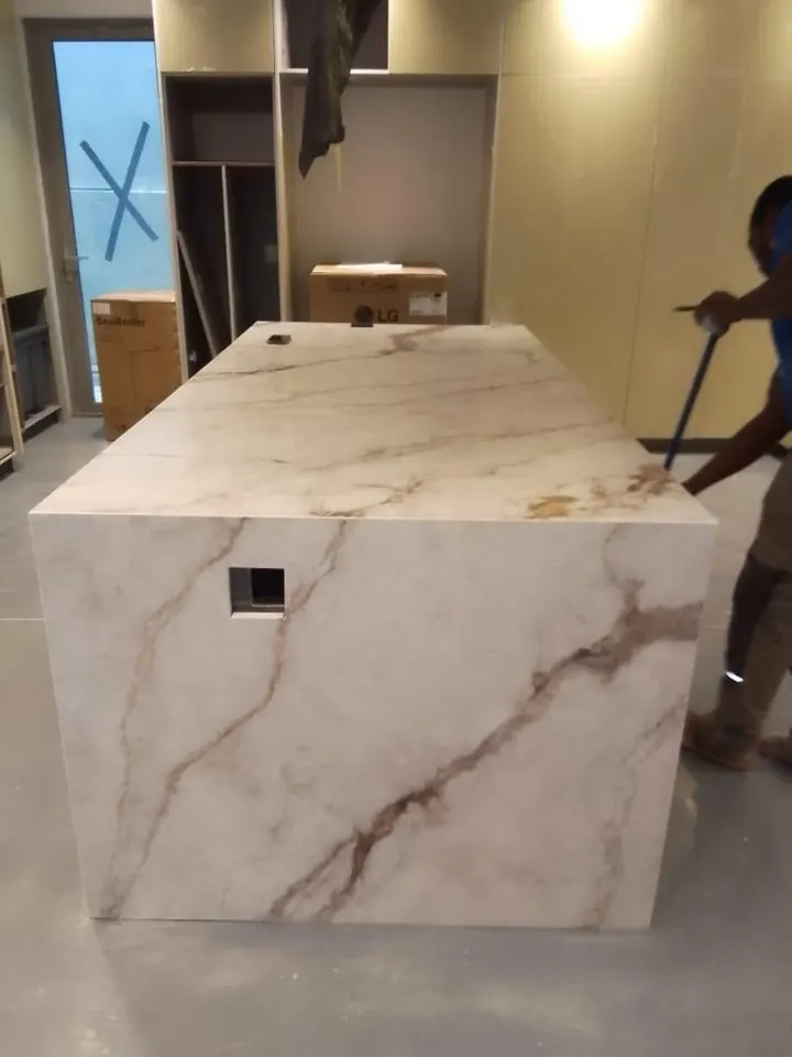 Marble-look waterfall island during installation
