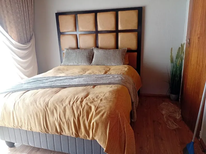 Padded panel headboard in tan